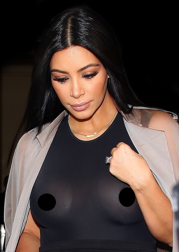 2a0a1bb000000578-3141603-exposed_kim_may_have_been_wearing_an_overcoat_but_she_wasn_t_cov-a-100_1435441593594